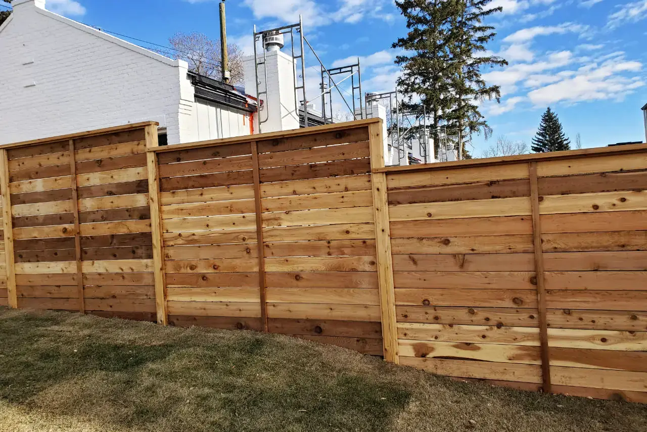 Classic wooden picket fence defining property boundary with charm