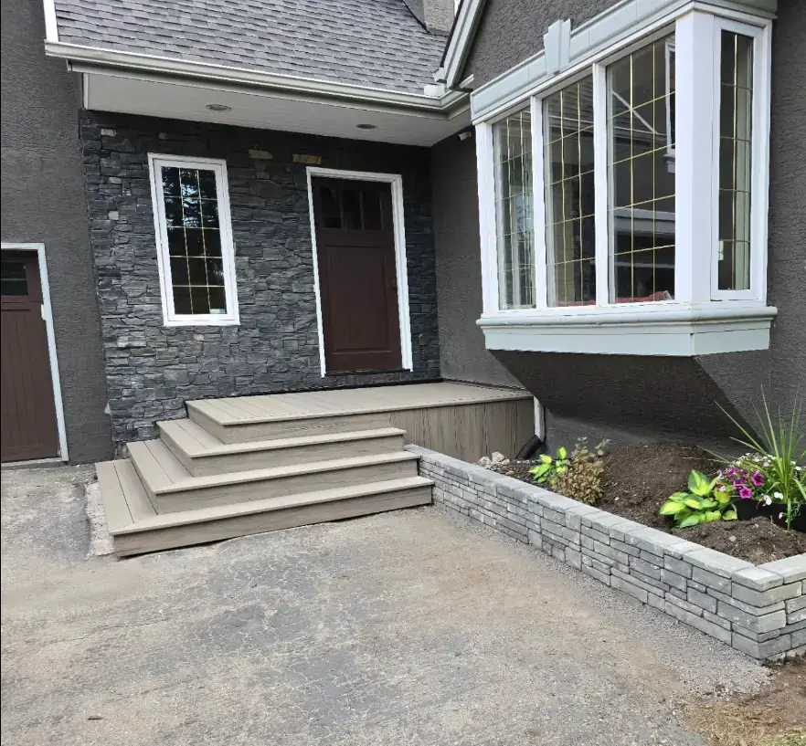 Complex landscaping project featuring retaining walls and integrated deck