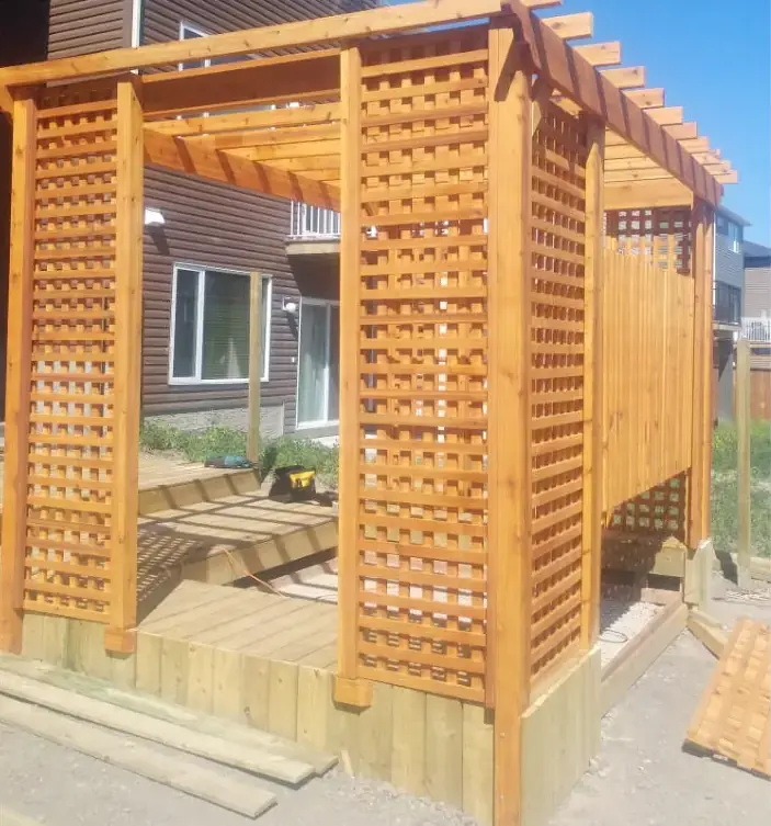 Comprehensive deck and pergola combination creating an outdoor living space
