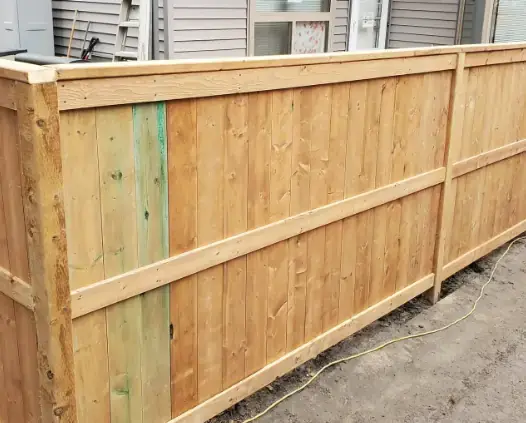 Modern wooden privacy fence installation in Calgary residential property
