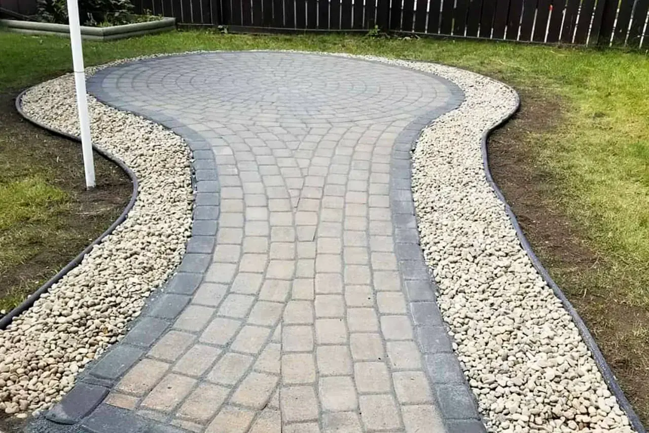 Stone patio with built-in fire pit area creating a welcoming gathering space