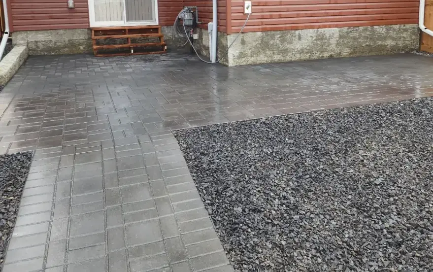 Expansive stone patio creating perfect outdoor entertaining area